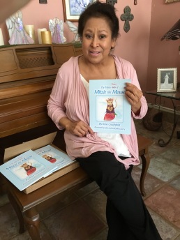 Irma showing off her first book Mitzie